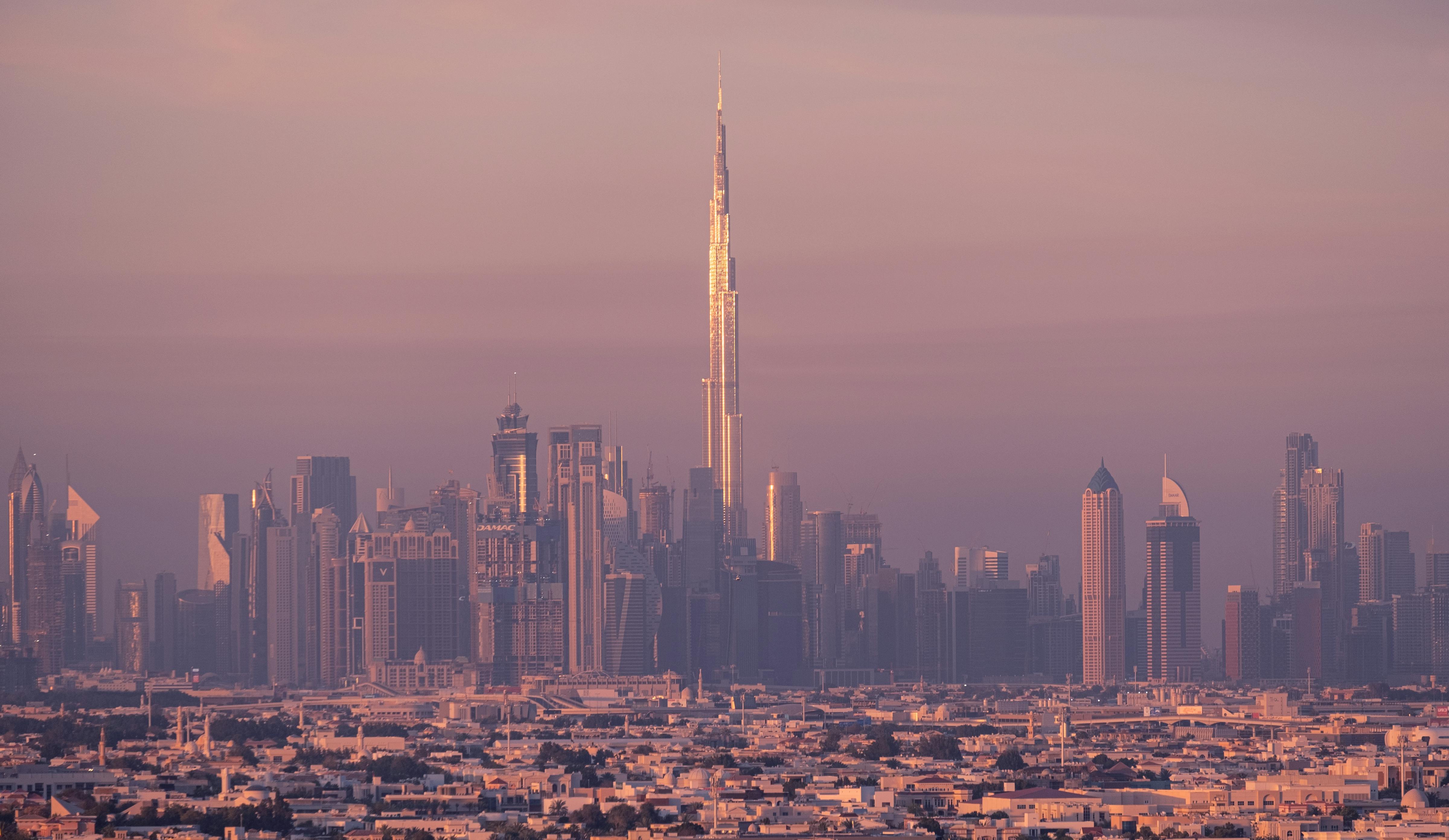 Burj Khalifa and the Dubai skyline at dusk.