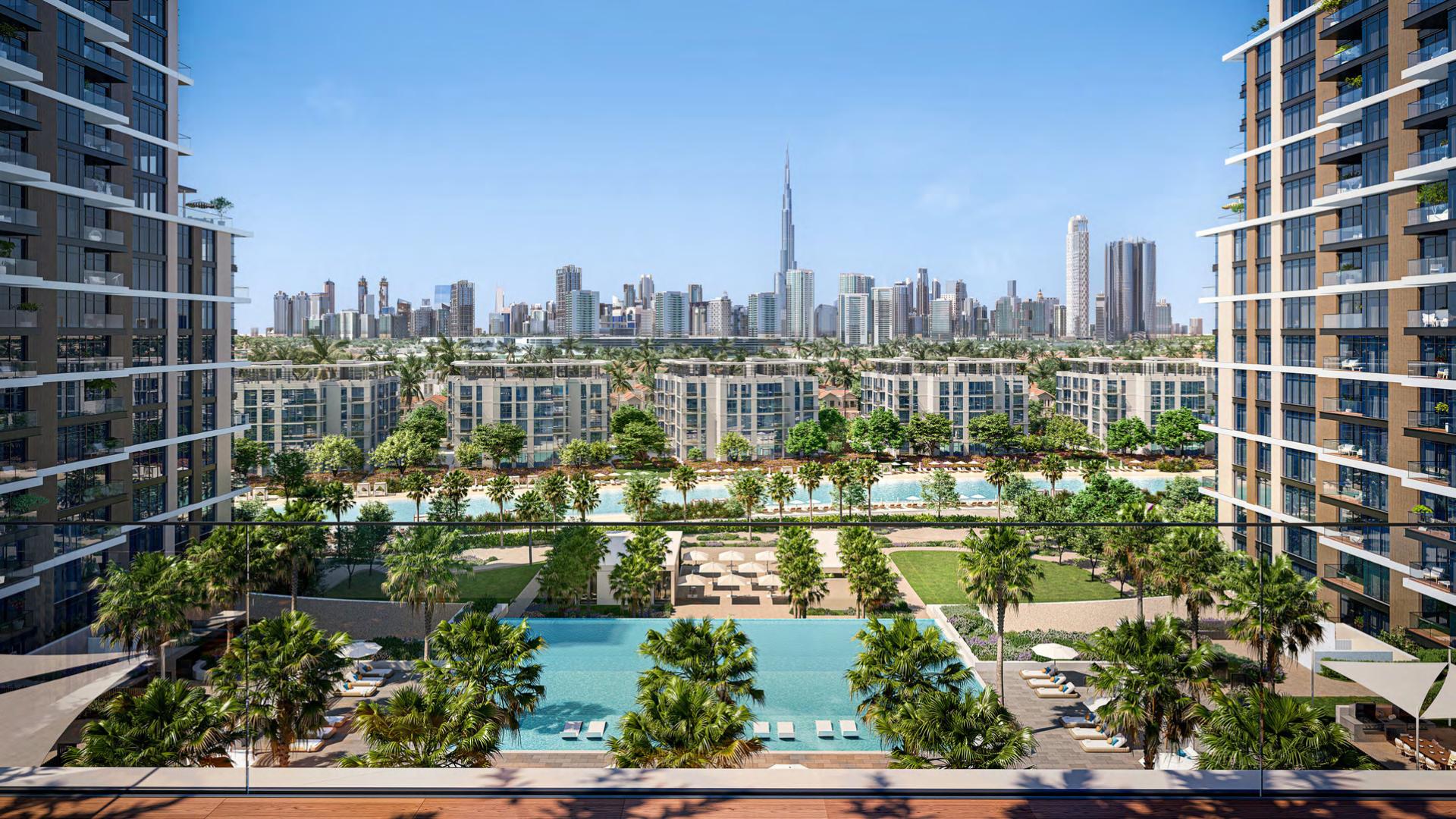 The Crystal Lagoon pools at District One with the Downtown Dubai skyline beyond.