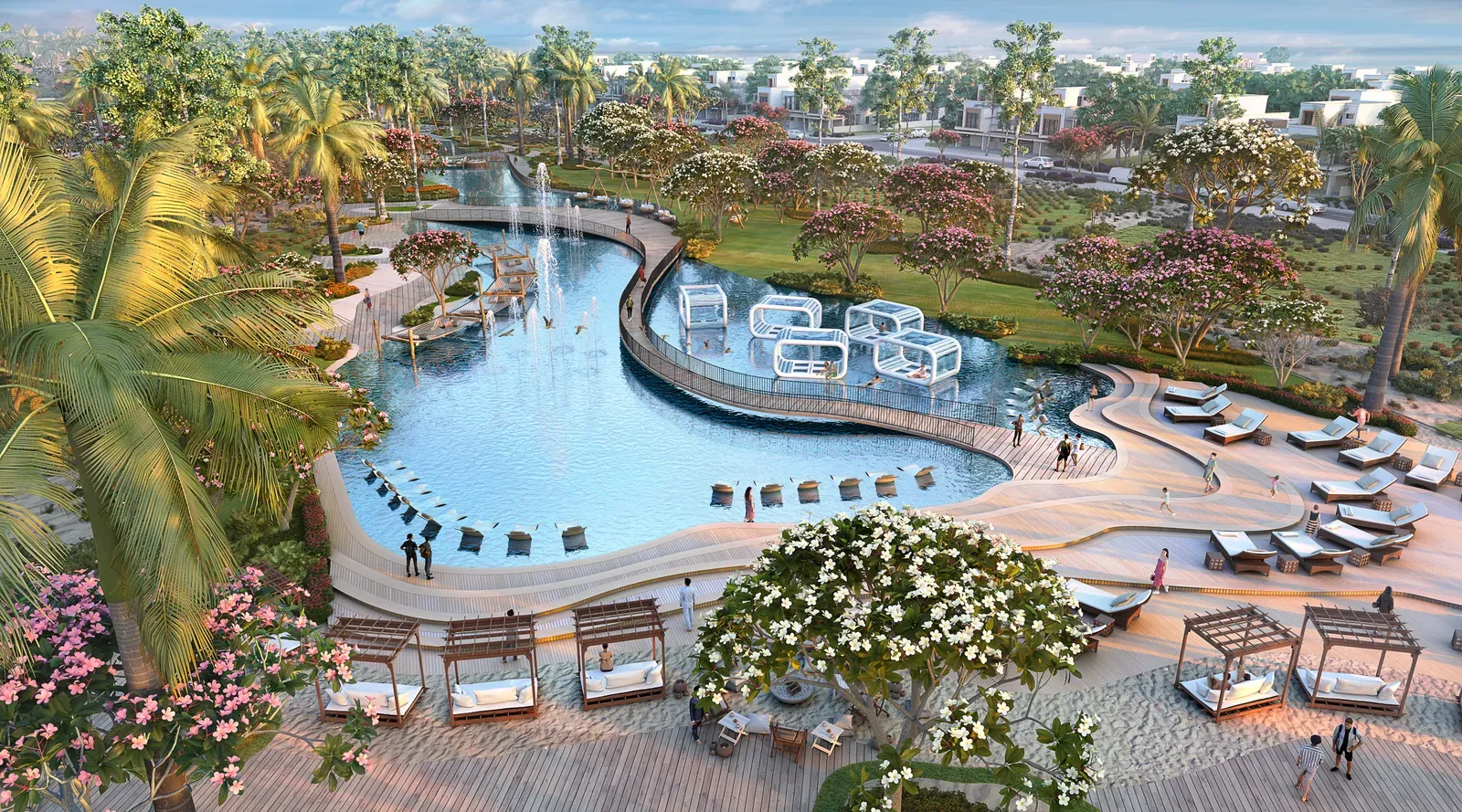 Aerial view of a curved swimming pool with cabanas and gardens at DAMAC Lagoons